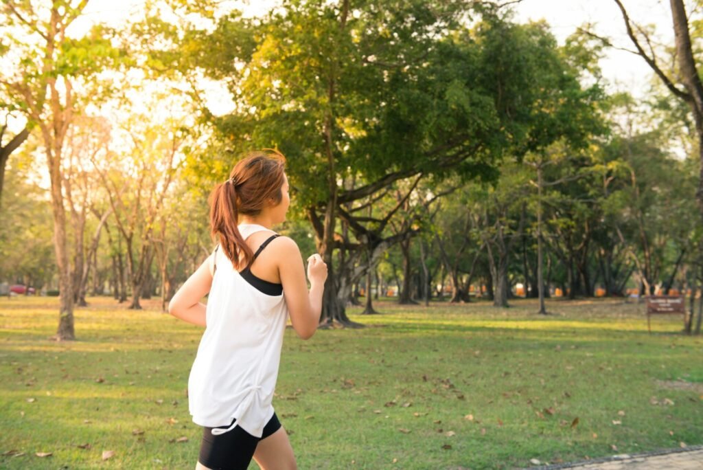 a women running in sunlight