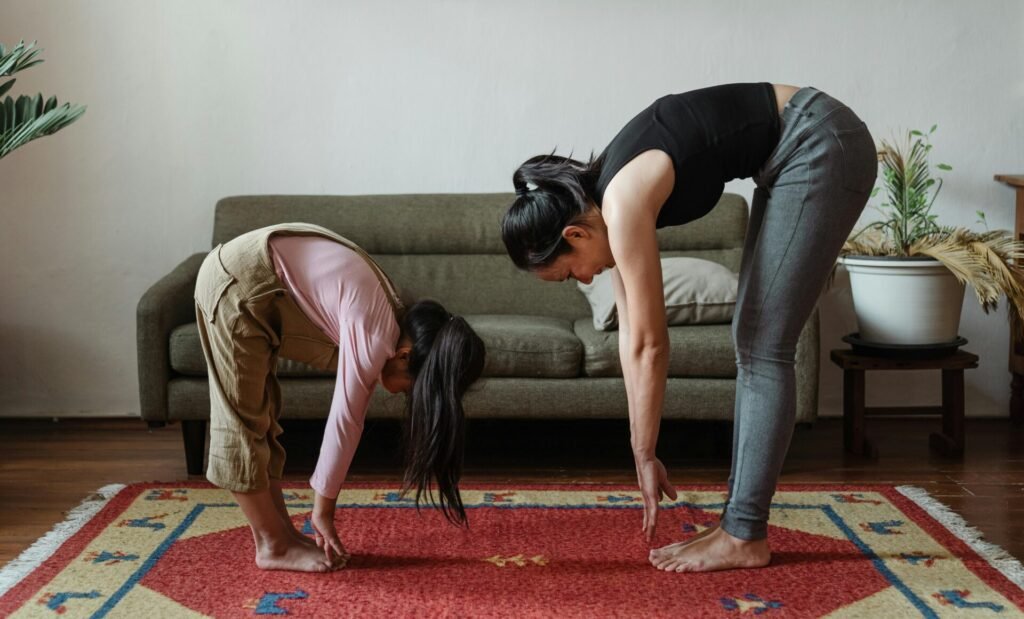 women doing morning exercise with daughter 