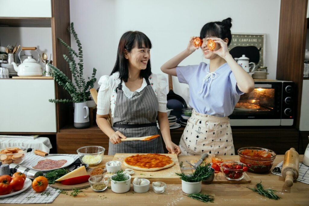 girls having fun while Cook or Bake together