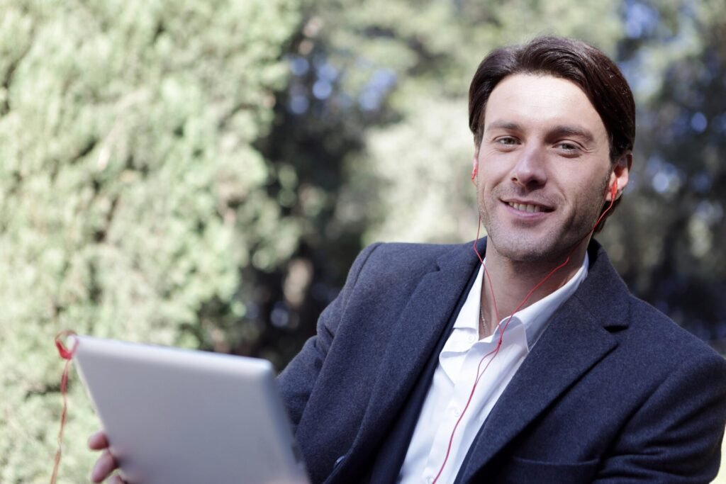 man in suit with laptop